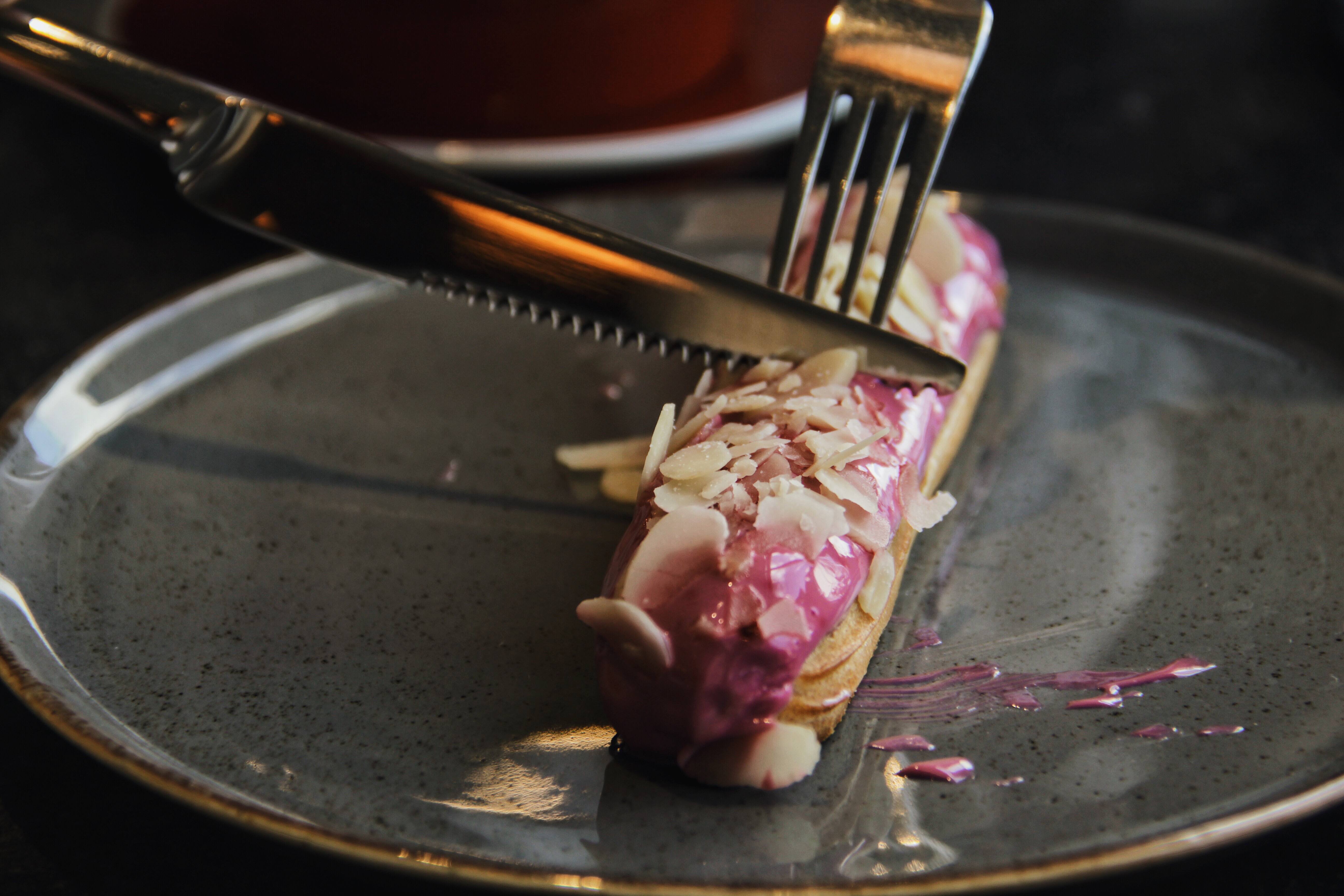 cutting chocolate eclair